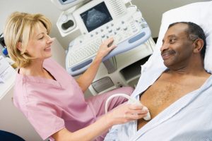 Woman performing ultrasound to the man